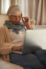 Senior woman, laptop and internet for website in home, retirement planning and glasses for reading....