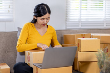 Startup small business entrepreneur SME freelance woman working with box, Young Asian small business owner office online market packing delivery, SME delivery e-commerce telemarketing seller concept