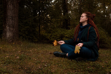 woman doing meditation in forest alone