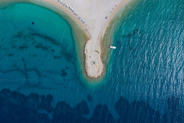 Aerial photography. The white coastline goes into the turquoise, transparent sea. Dalmatia,...