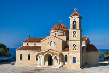 Fototapeta na wymiar The Greek-Orthodox church of Agios (Saint) Raphael (built in 1991 in Byzantine style) in the village of Pachyammos, district of Nicosia, Cyprus. 