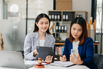 Asian Business law concept, Lawyer business lawyers are consulting lawyers for women entrepreneurs to file copyright lawsuit