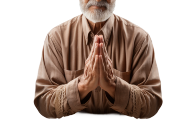An older man with a white beard is balancing on one leg, arms outstretched, in a yoga pose. He appears focused and steady in his movement, showcasing strength and flexibility.