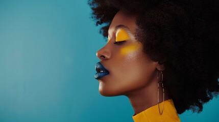 Feature portrait of a satisfied brunette young woman with afro hairstyle, creative yellow make up, lips and eyeshadows on a colorful background. - obrazy, fototapety, plakaty