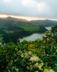 Sunrise at the crater lake Lagoa das Furnas in the volcanic caldera on Sao Miguel island (Azores,...