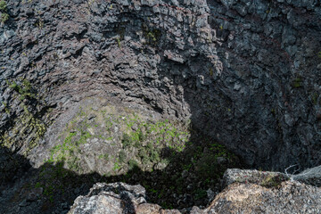 Devils Throat. Hawaiʻi Volcanoes National Park. Chain of Craters Rd. pit craters are depressions that form primarily as the earth fractures when a volcano shifts or expands. 