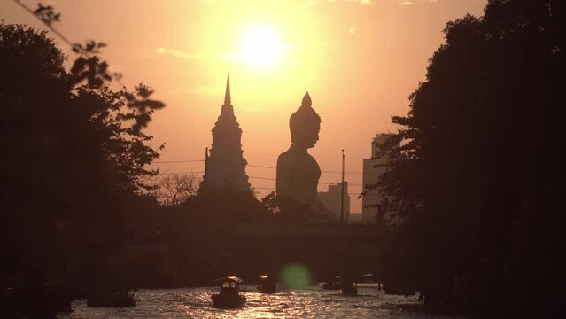 Evening sunset timelapse at The Giant Buddha Statue at the Wat Paknam Phasi Charoen temple