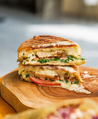 macro shot of a quesadilla on a wooden board