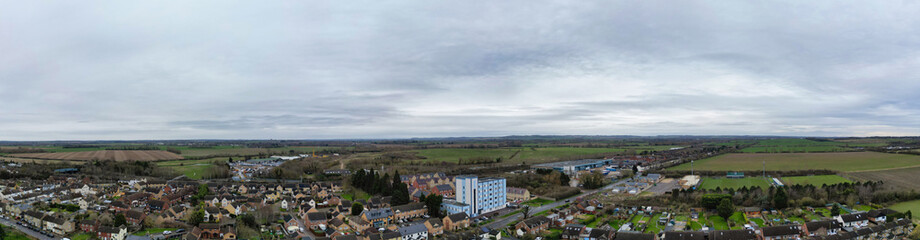 Obraz premium High Angle Ultra Wide Panoramic View of Arseley Town of England UK. The Footage Was Captured During Cloudy and Rainy Day of Feb 28th, 2024