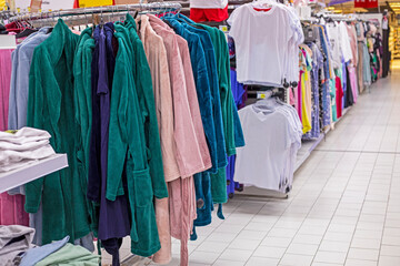 stylish clothes for home, bathrobes, T-shirts in the supermarket