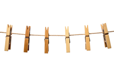 A clothes line with numerous clothes pins attached to it, holding up various items of clothing. The scene depicts a practical and efficient method of drying garments outdoors.