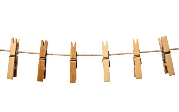 A clothes line with numerous clothes pins attached to it, holding up various items of clothing. The scene depicts a practical and efficient method of drying garments outdoors.