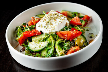 greek salad with cheese, tomato, olive, pepper, onion