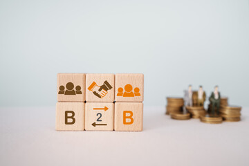B2B, abbreviation for business to business marketing symbol. Word B2B and icon on wooden cube...