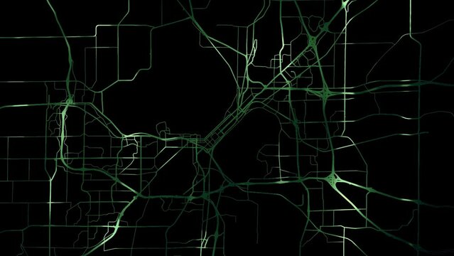 Zoom in road map of Madison Wisconsin with green glowing roads on a black background.