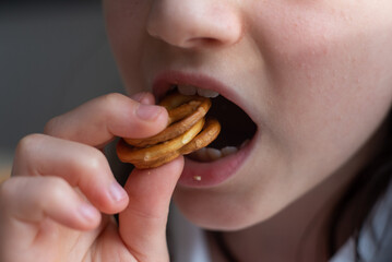 Girl Eating German Pretzel: Close-Up