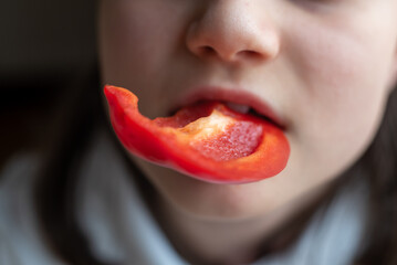Child Eating Bell Pepper: Close-Up of Mouth