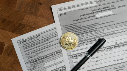 Cryptocurrency investment tax return PIT-38 polish form with golden bitcoin