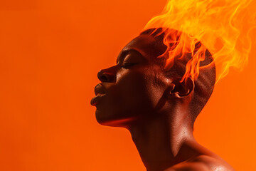 extreme heat concept an african american person with his head on fire due to high temperatures - 747937035