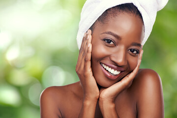 Woman, portrait and skincare or beauty in nature with towel for dermatology and wellness on green background. Face of young model or African person with smile for hygiene, cosmetics or cosmetology