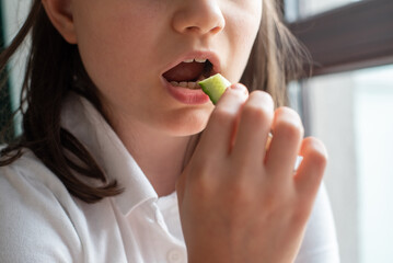 Child Eating Cucumber: Close-Up of Mouth