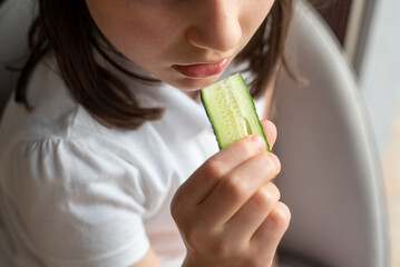 Child Eating Cucumber: Close-Up of Mouth