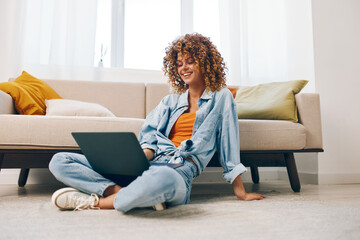 Smiling Woman Typing on Laptop, Enjoying Freelance Job in Cozy Home Study Room