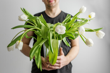 Man Holding Vase of White Tulips - Greeting Postcard