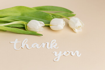 Gratitude Expressed with White Tulips and Thank You Note