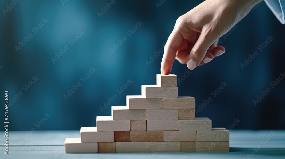 Poster person placing a block into a pyramid. suitable for educational and construction concepts