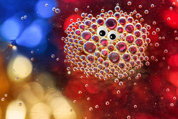 Funny bunch of bubbles with googly eyes and a colorful background 