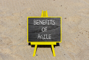 Benefits of agile symbol. Concept words Benefits of agile on beautiful black chalk blackboard. Beautiful sand beach background. Business benefits of agile concept. Copy space.