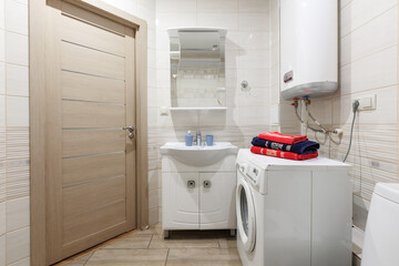 modern bathroom room with toilet and washing machine