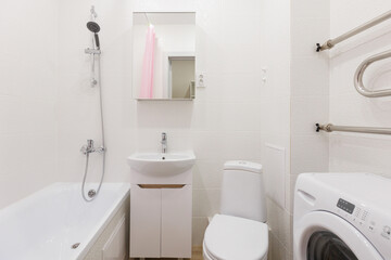 modern bathroom room with toilet and washing machine