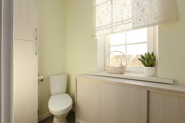 modern bathroom room with toilet and washing machine