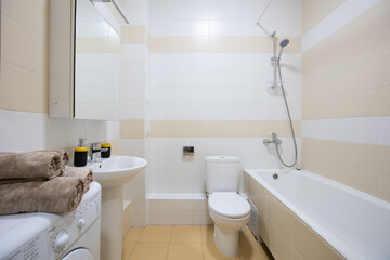 Obraz na płótnie Canvas modern bathroom room with toilet and washing machine