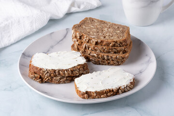 Slices of rye bread with cottage cheese