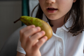 Girl Eating Pear: Close-Up