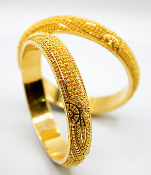 Indian design gold bangle isolated on white background