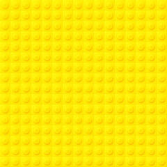 Yellow plastic blocks background. Seamless pattern or construction plate