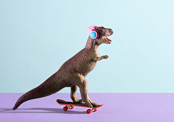 Cute dinosaur skates and listens music on blue and violet background.