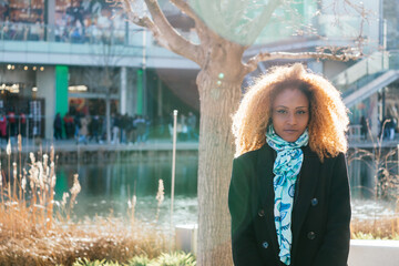 Portrait of black Woman waiting outside a shopping mall