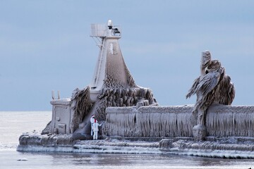 A pier is covered by ice formations by a storm