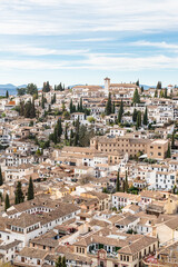 Fototapeta na wymiar Aerial view of the Albaicin in Granada, one of the oldest districts in the city, with its historic monuments and traditional houses.