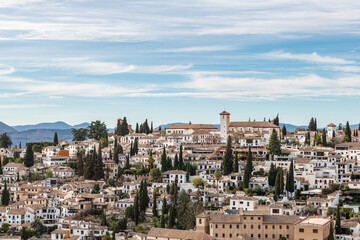 Fototapeta na wymiar Aerial view of the Albaicin in Granada, one of the oldest districts in the city, with its historic monuments and traditional houses.