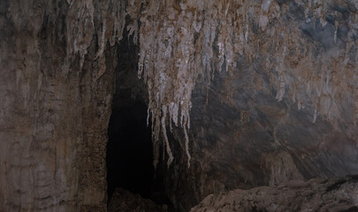 Fototapeta na wymiar Stalactites in a karst cave