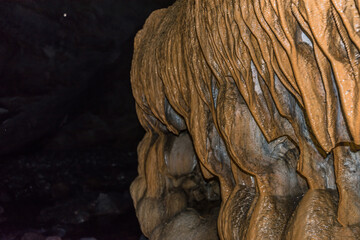 Fototapeta na wymiar Stalactites in a karst cave