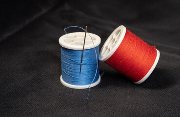 needle and thread red and blue