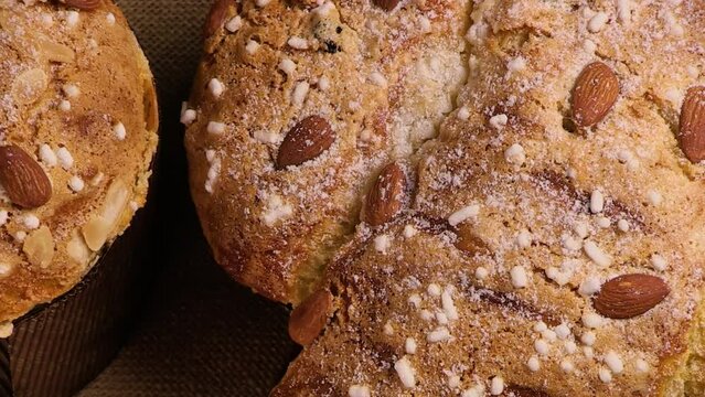 Colomba and Panettone cake is a traditional Italian dessert for Easter and Christmas. Easter cake with dove. Easter and Christmas pastries. Zooming the camera from close-up to wide angle