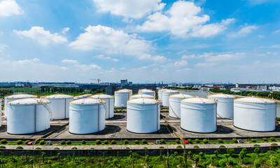 Aerial view of large white Industrial oil tanks. Business fuel and energy.